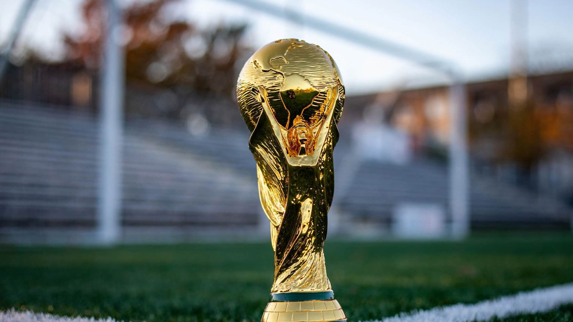 Football World Cup trophy in a football pitch