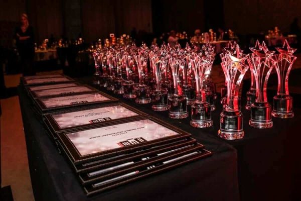 table of certificates and trophy's from Global Magazine Awards Night