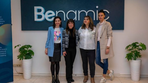 Benamic employees in front of Benamic sign at new Hybrid Office place