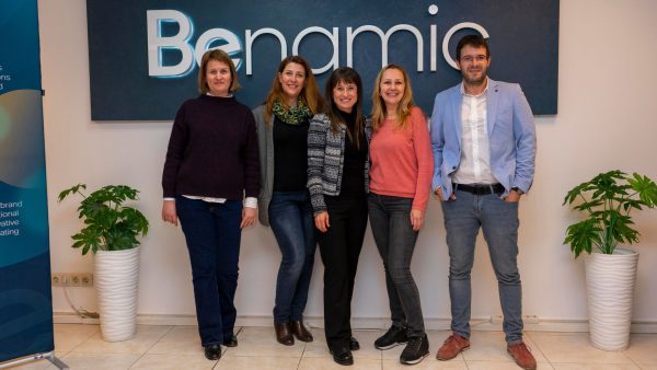 Benamic employees in front of Benamic sign at new Hybrid Office place