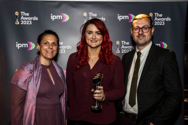 Benamic employees holding Benamic's award at IPM Awards night.