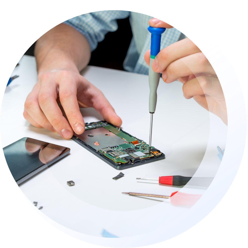 Man repairing phone using a screwdriver