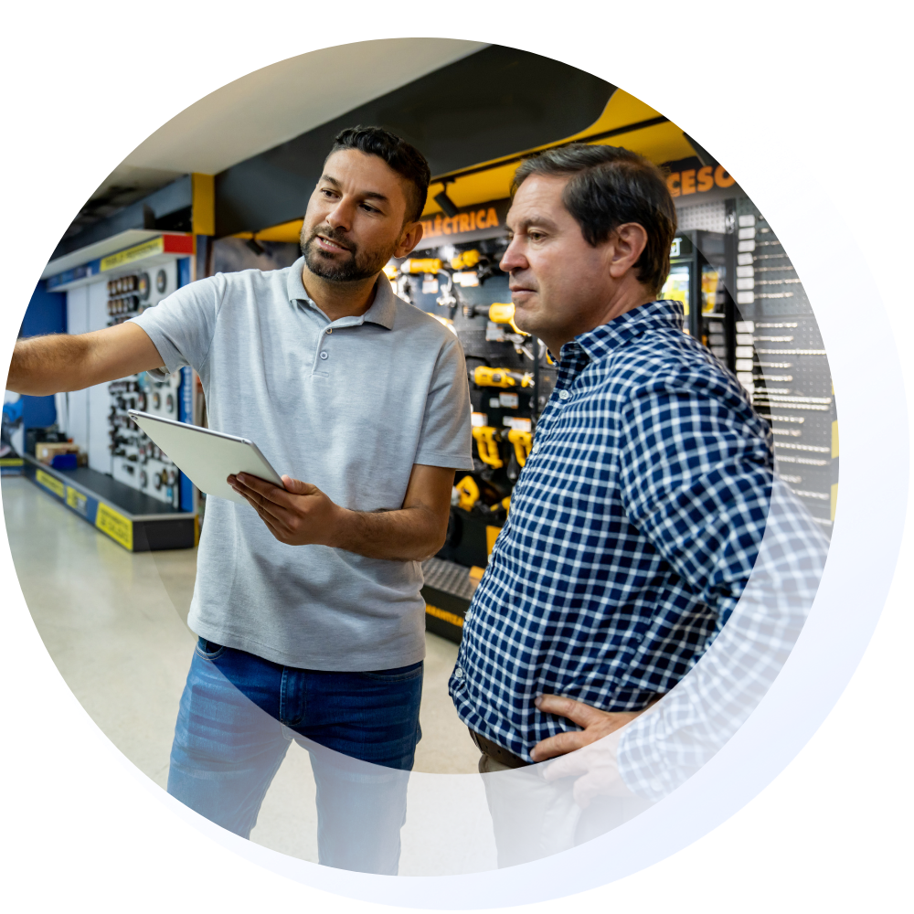 Man speaking to customer in power tools shop