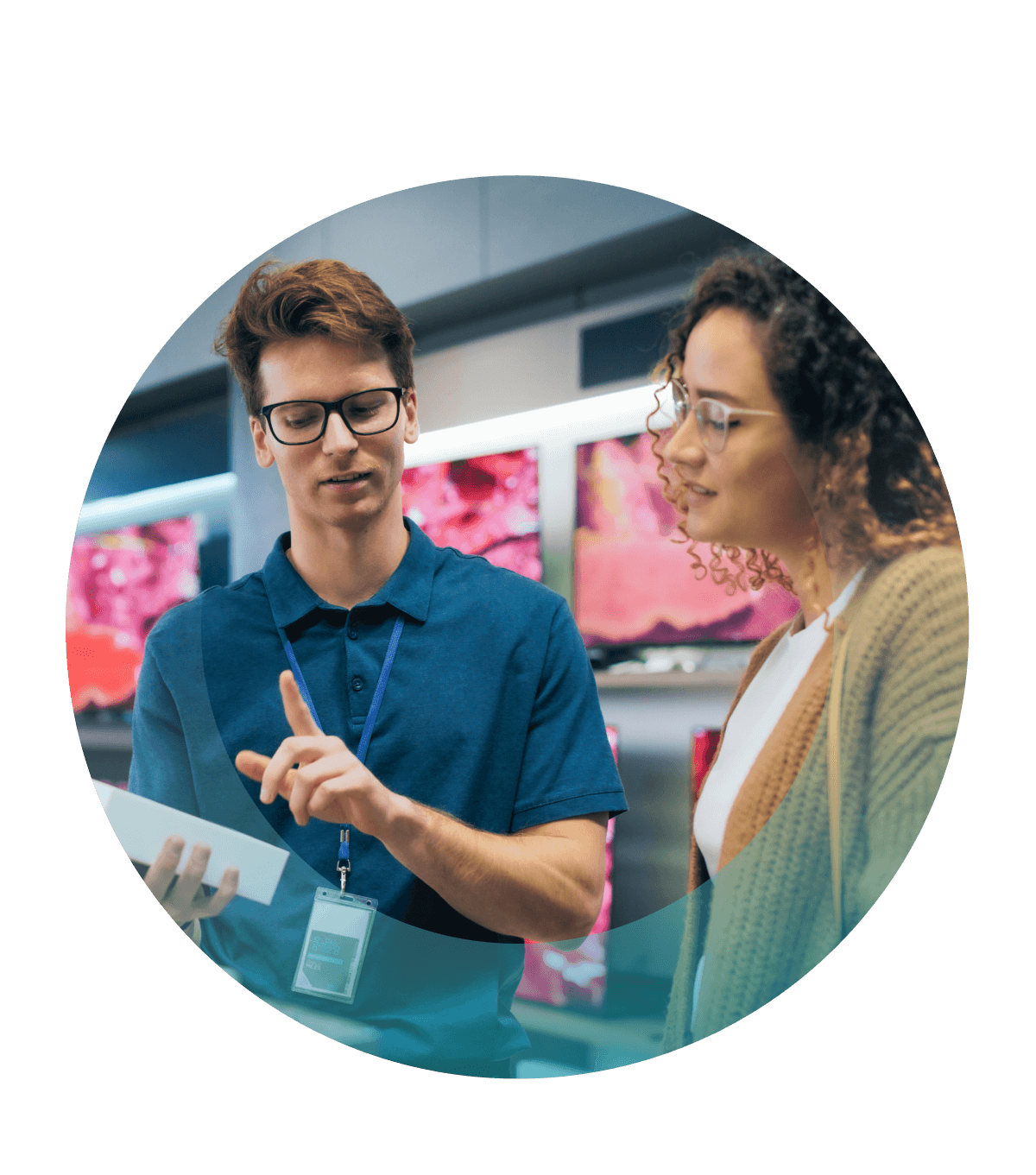 Sales staff talking with customer in electronics store