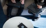 Benamic Employees on their laptops in a office with Benamic notebook