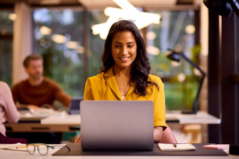 marketer working on her laptop in a office