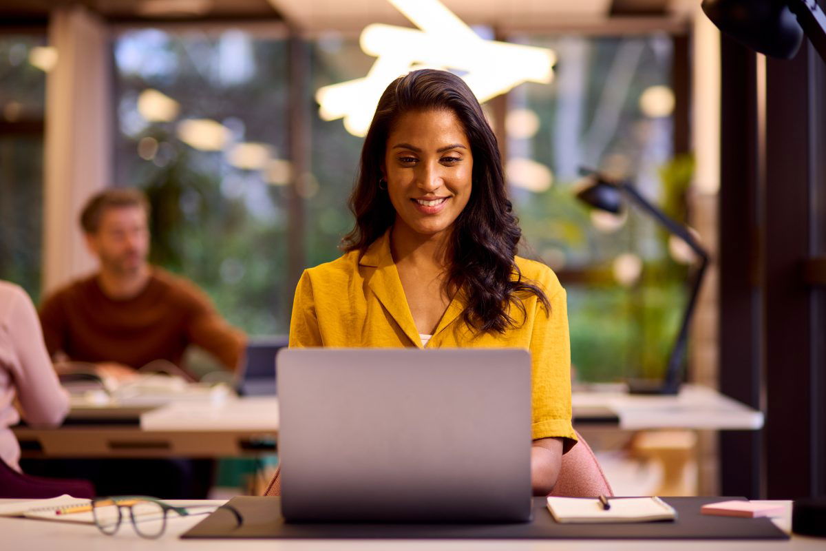 marketer working on her laptop in a office