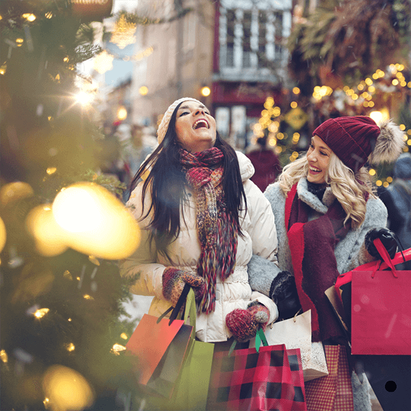 Women enjoying Christmas shopping together