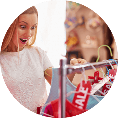 Woman looking at clothing on sale